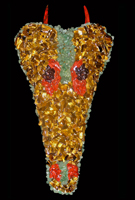 Aphanerama: (Skull) resin replica of an Aphanerama; an amphibian from the late Triassic period. (Horns) resin replicas of Velociraptor claws, a dinosaur of the late Cretaceous period. The piece is covered with tumbled and polished Tiger’s Eye, Red Jasper, Aventurine and Garnet stones. (Size) Approximately 14 x 17 inches
