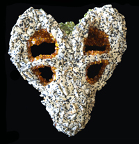 Dicynodontian:
						(Skull) resin replica of a Dicynodontian; a mammal type reptile of the Permian period. The piece is covered with tumbled and polished Dalmation, Peridot and Amber stones.	(Size) Approximately 7 x 
						6 x 3 inches